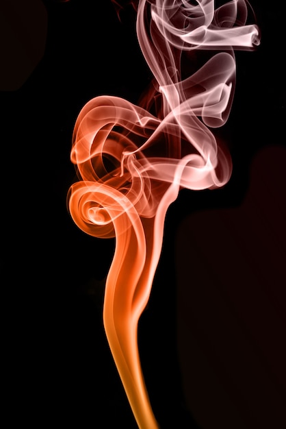 rolling colorful smoke on black background