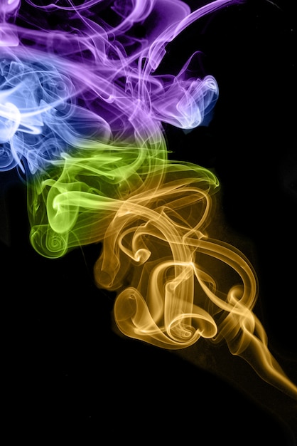 rolling colorful smoke on black background