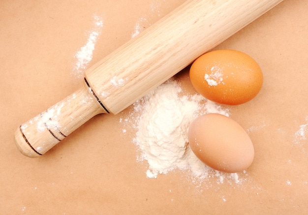 Rolling pin, eggs and flour. Domestic cooking of a bakery