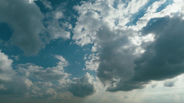 Rolling puffy clouds are moving nature weather blue sky rainy clouds background relax