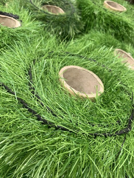 Rolls of artificial grass floor covering