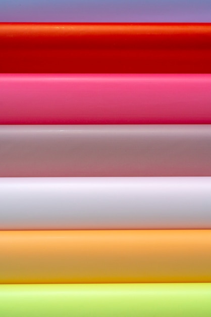 Rolls of colored wrapping paper. Abstract economic background.