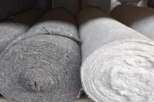 Rolls of factory textiles closeup Raw material or material for the manufacture of rags