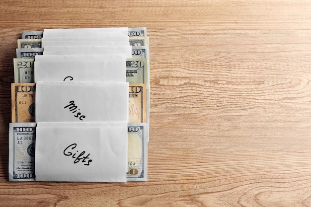 Rolls of money for needs on wooden background