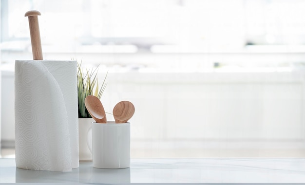 Rolls of paper towels on white table.