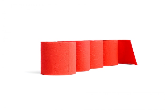 Rolls of red coral toilet paper isolated on white 