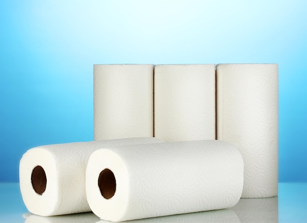 Rolls of toilet paper on blue background