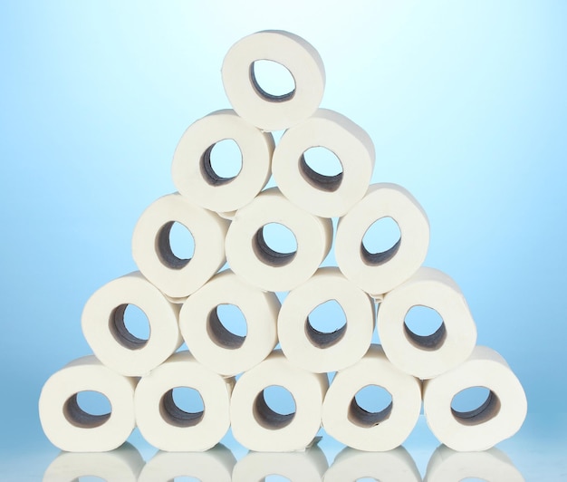 Rolls of toilet paper on blue background