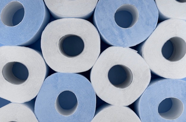 Photo rolls of white and blue toilet paper. shortage of toilet paper.