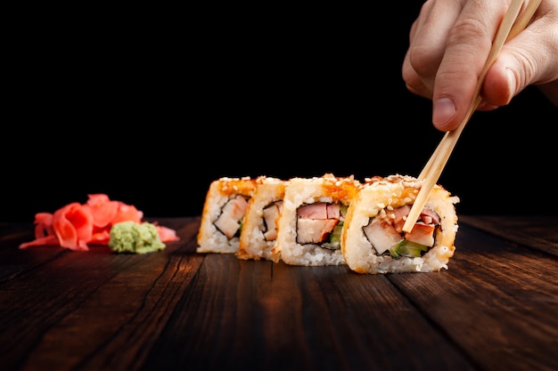 Rolls with bacon on a wooden table.