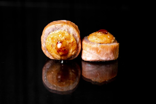 rolls with reflection on black background photo for menu design