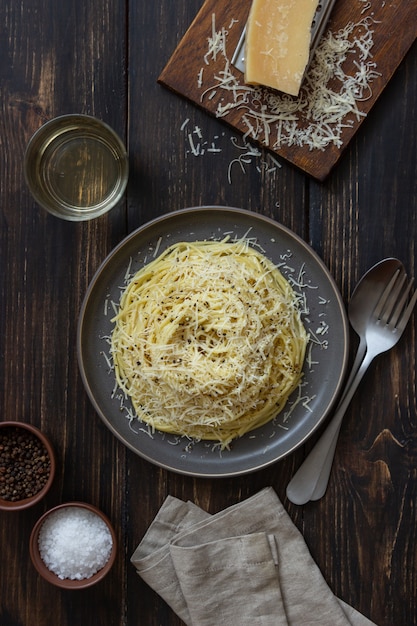 Roman pasta spaghetti with black pepper and cheese. Cacio e pepe. Recipes. Wine. Vegetarian food. National cuisine.