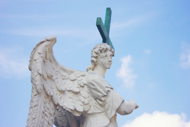 Roman statue with a cross