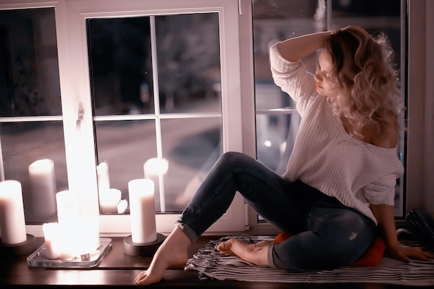 romance adult girl candles / sexy model in a romantic interior lonely waiting