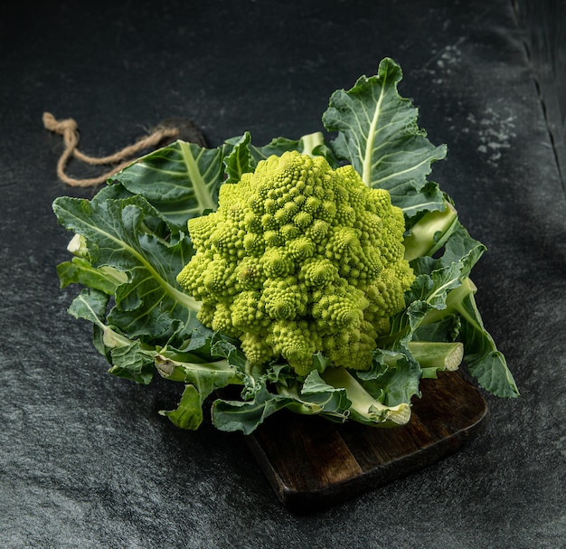 Romanesco broccoli head on a dark stone surface cabbage close up fibonacci sequence for those who love mathematics