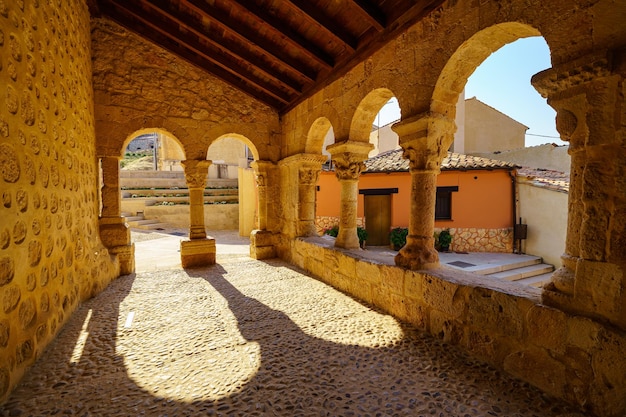 Romanesque cloister with stone arches in the church of san\
miguel in the village of san esteban de gormaz