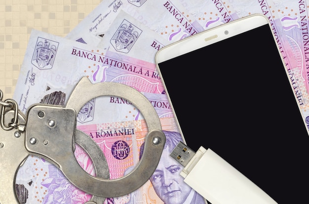 romanian leu bills and smartphone with police handcuffs