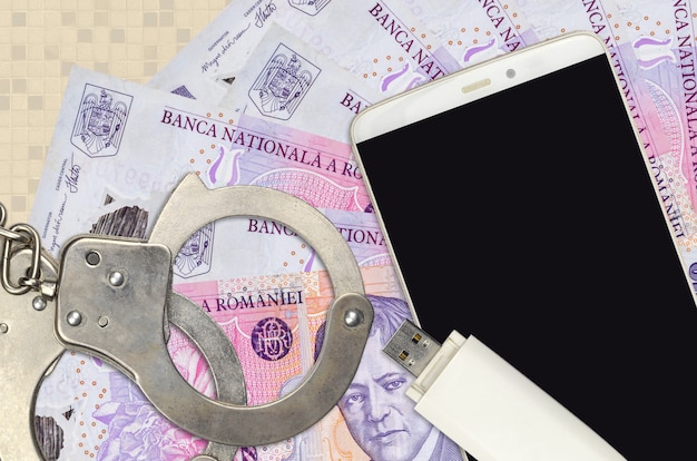 Romanian leu bills and smartphone with police handcuffs