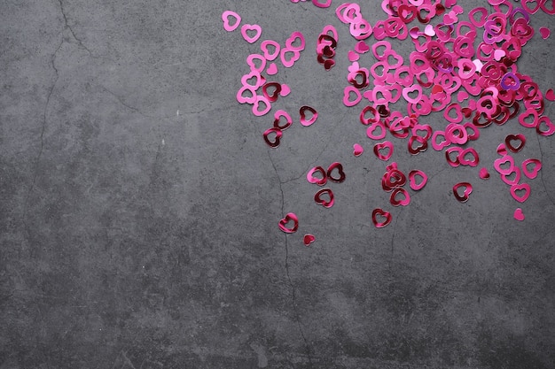 Romantic background. The concept of love and relationships. Heart shaped figures on a dark background. Card for Valentine's Day.