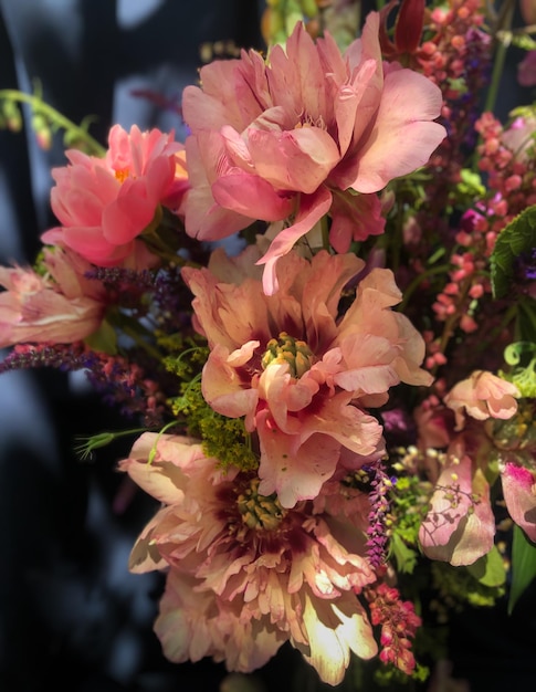 Romantic bouquets of spring flowers with peonies sage foxglove geyhera