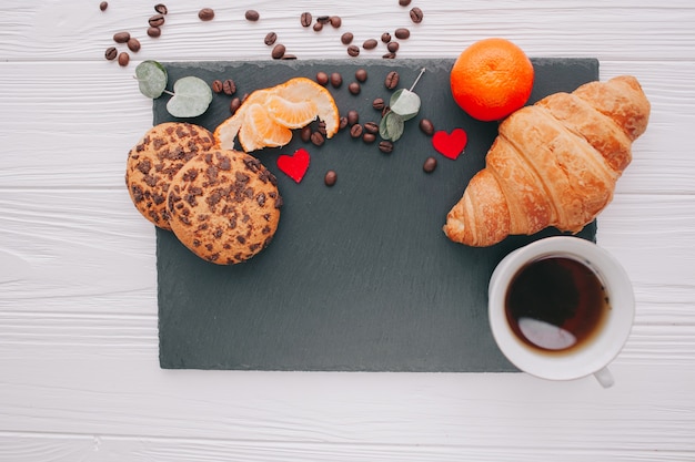 romantic breakfast with croisant and fruits