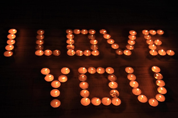 Romantic candles on dark background