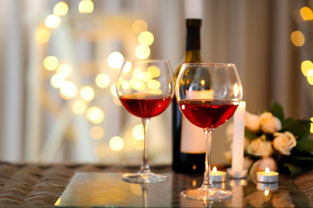 Romantic composition with wine on blurred background