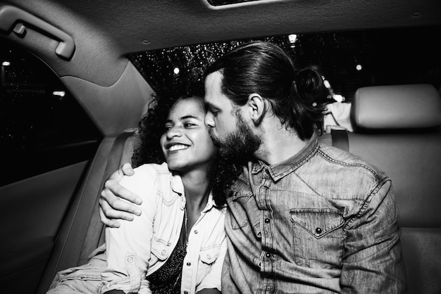 Romantic couple in a backseat of a taxi