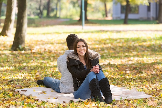 Romantic Couple On A Blanket In Autumn Park