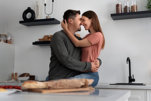 Romantic couple celebrating valentine's day together at home