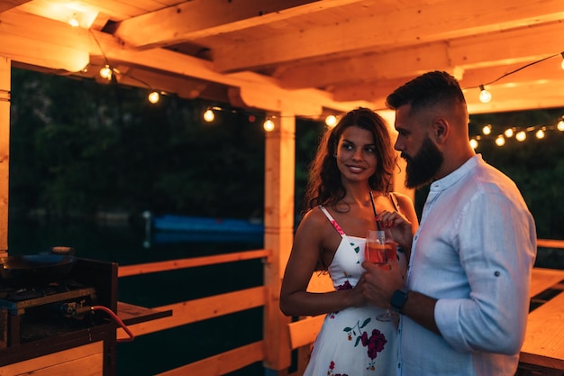 Romantic couple on date at the terrace by the river