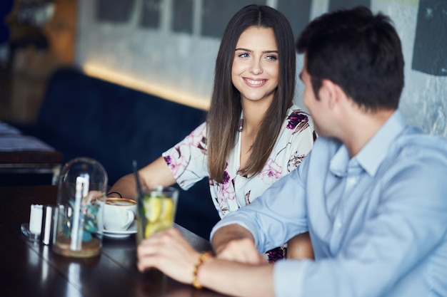 romantic couple dating in pub