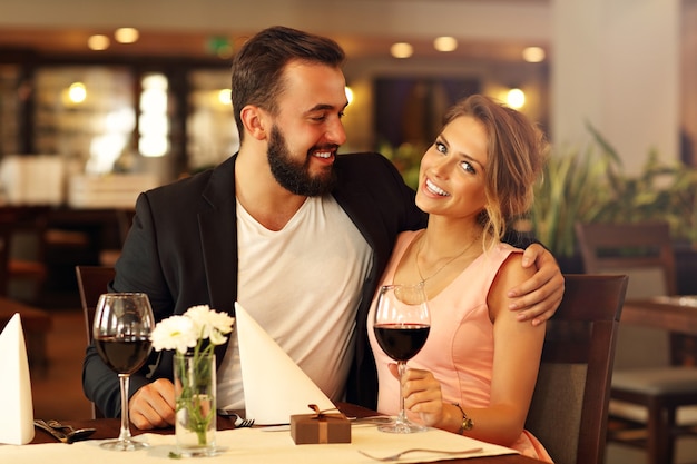 romantic couple dating in restaurant