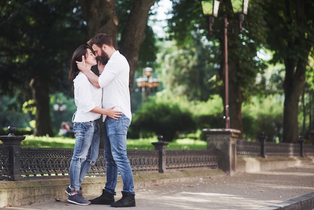 Romantic couple enyojing in moments of happiness in the park. Lifestyle concept love and tenderness