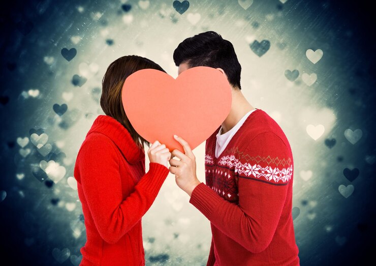 फोटो romantic couple holding heart shape and kissing each other
