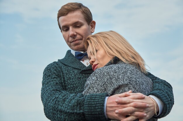 Romantic couple hugging in the autumn park