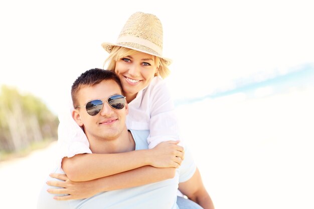 romantic couple hugging at the beach