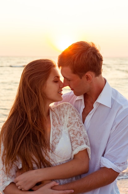 Romantic couple kissing on the beach