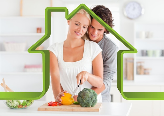 Romantic couple in kitchen against house outline in background