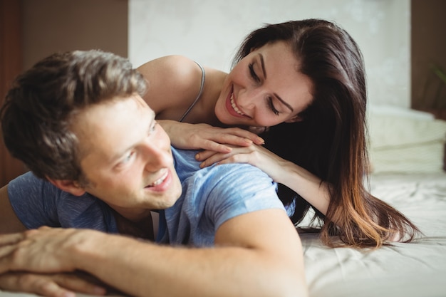 Romantic couple relaxing on bed