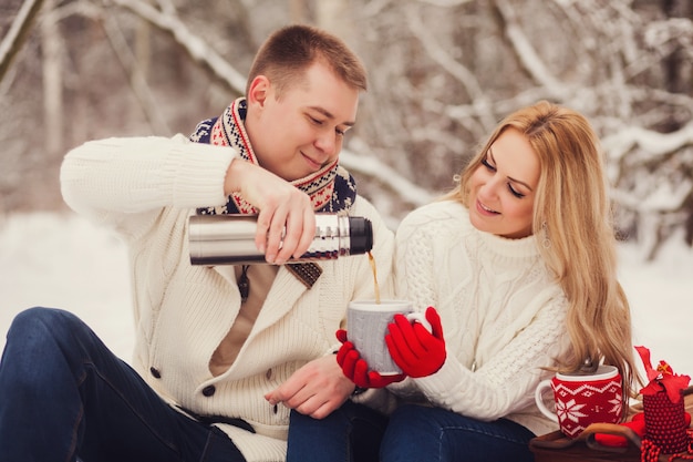 Romantic couple relaxing in the forest