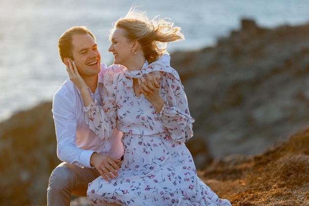 romantic couple resting by the sea