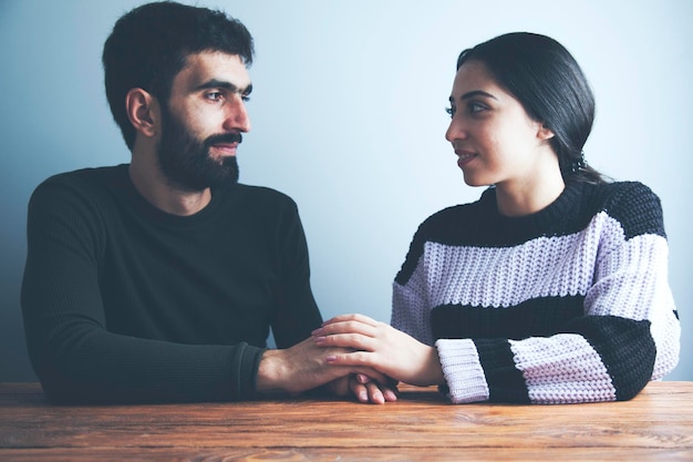 Romantic couple sitting in home