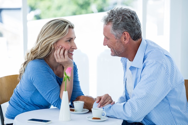 Romantic couple sitting at restaurant