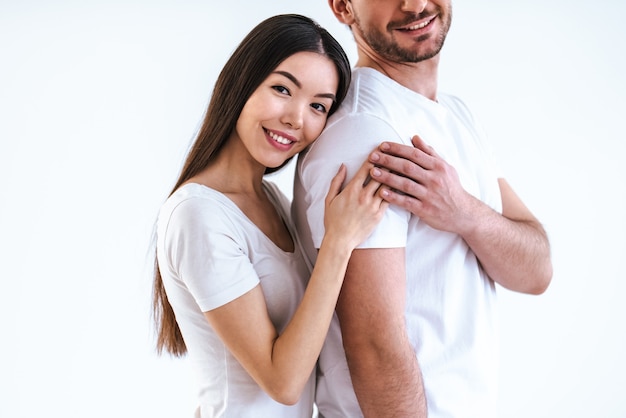 The romantic couple standing on the white background