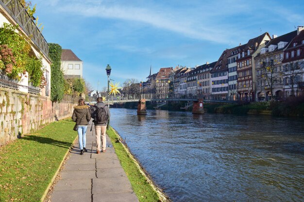 Romantic couple walking by the canal water valentines day relationship