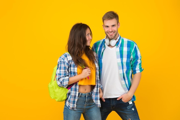 Romantic date Couple in love yellow background Sexy woman and handsome man in casual style Romantic relationship Love and romance Feeling young and happy