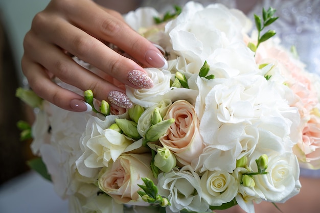 Romantic decorations, white light flowers for the holiday, wedding rings for the bride