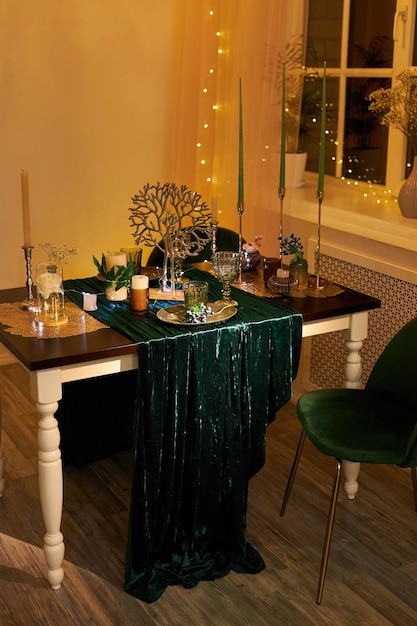 Romantic dinner table setting with festive lights