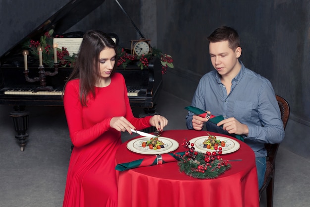 Romantic dinner of young love couple at luxury restaurant.